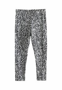 Leggings noir et blanc avec un motif de zèbre, fabriqués dans un matériau extensible et doux avec une taille élastique.