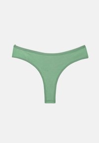 String vert en coton pour femme avec ceinture élastique, bords sans coutures et design minimaliste sur fond blanc uni.
