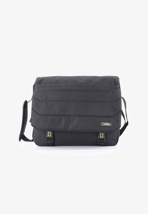 Black messenger bag made of durable fabric, featuring quilted texture, adjustable shoulder strap, and two yellow buckle accents.