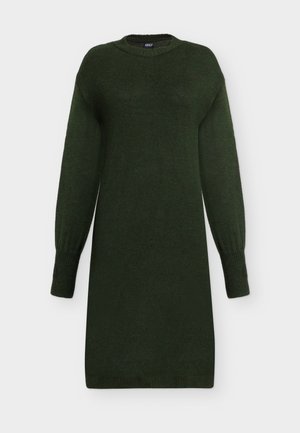 Temno zelena pletena obleka z dolgimi rokavi, rebrastimi manšetami, spodnjim robom in okroglo izrezom, prikazana na enobarvnem svetlem ozadju.