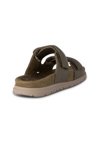 Bruna syntetiska sandaler med justerbara remmar, mjuk mocka fotbädd och en lätt beige sula. Minimalistisk design utan några ytterligare dekorationer.