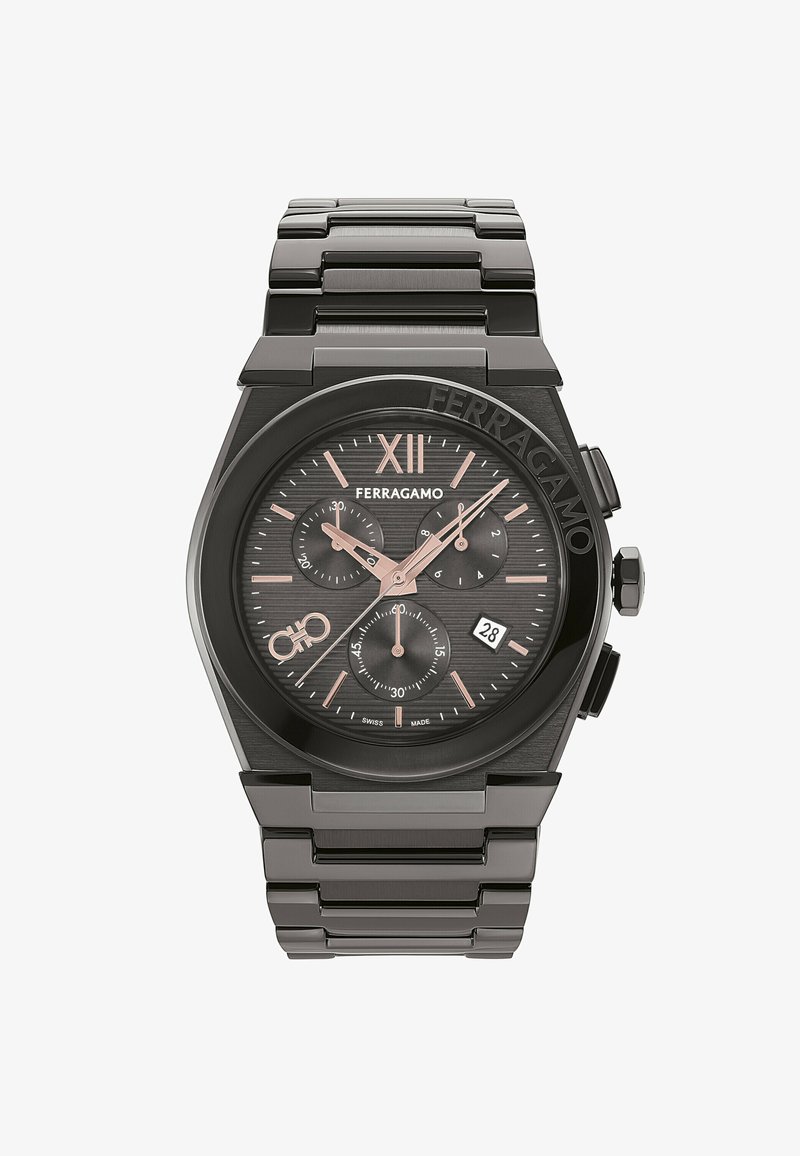 Moška analogna ura s črnim pasom in ohišjem iz nerjavečega jekla. Ima črn teksturiran številčnico, rožnato zlate detajle in prikaz datuma.