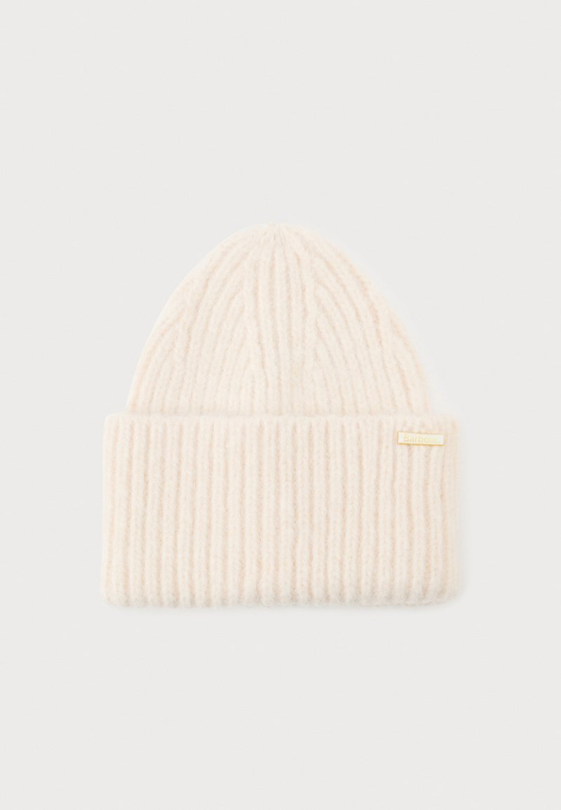 Beige knitted beanie hat with a ribbed texture, featuring a cuff and a small gold metal logo tag. Soft material and elongated top shape.