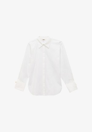 Chemise blanche à manches longues avec col pointu et larges poignets, présentée à plat sur un fond blanc.