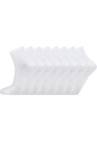 Vita ankelsockor gjorda av mjukt tyg, med en slät yta och ribbade muddar. Sex par är placerade sida vid sida.