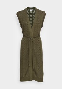 Olivgrön stickad kofta med V-hals, öppen framsida och ett knytbälte. Har vågiga kanter och ett strukturerat chevron-mönster.