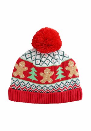 Red knitted beanie with white, green, and gold patterns, featuring gingerbread men and Christmas trees, topped with a red pom-pom.