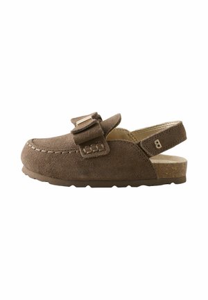 Brown suede children's clog with adjustable strap over the foot and open heel strap, featuring detailed stitching and a cork sole.