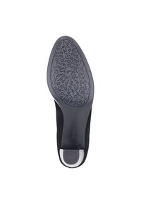 Scarpa nera con tomaia liscia e suola in gomma con motivo. Presenta una punta rotonda e un tacco leggero con un contrasto bianco.