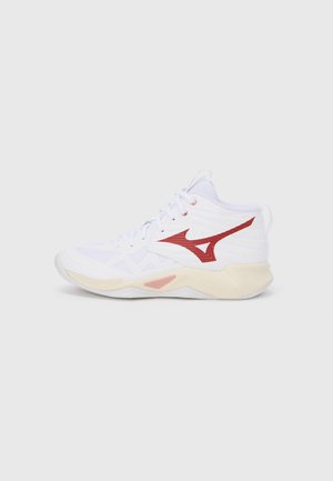 High-top basketball shoe featuring a white mesh upper, red accents, and a cushioned cream sole. Notable design includes zigzag patterns.