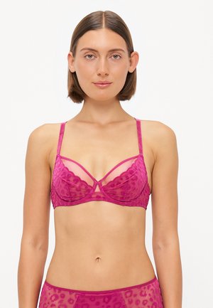 Magenta semi-sheer padded bra with leopard print texture, adjustable straps, and a structured design featuring a geometric underwire detail.