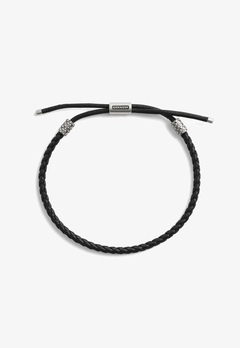 Bracelet en cuir tressé noir avec une fermeture cordon réglable. Accents en tube et perles en finition argentée. Design minimaliste.