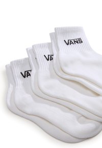 Hvide bomuldsankelsokker med ribbede manchetter, med "VANS" mærket logo i sort på hver sok. Pakke med fire par.
