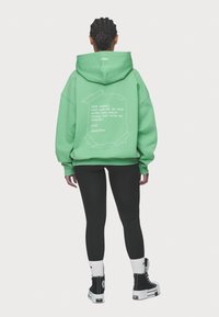 Pegador AURORA OVERSIZED HOODIE - Sportinis megztinis - washed peppermint green
