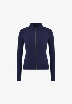 Giacca a zip navy realizzata in tessuto elasticizzato. Presenta un colletto alto, maniche lunghe e dettagli con zip color oro lungo la parte anteriore.