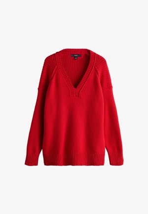 Sarkans adīts džemperis ar dziļu V-veida kakla izgriezumu, ribotām aprocēm, apakšmalu un plecu detaļām, brīvā piegriezumā.