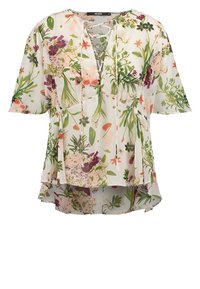 Blouse blanche à manches courtes avec motif floral vert, rose et orange, encolure en V avec détail de lien croisé et ourlet asymétrique.