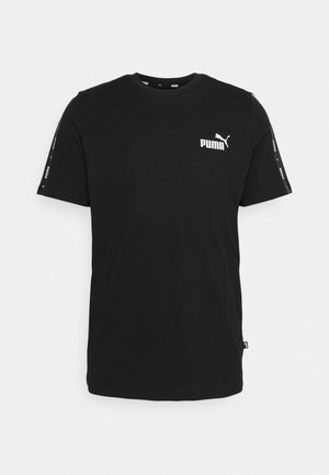 Camiseta de algodón negra con cuello redondo y mangas cortas. Presenta un logo blanco de Puma en el pecho y una marca en las mangas.