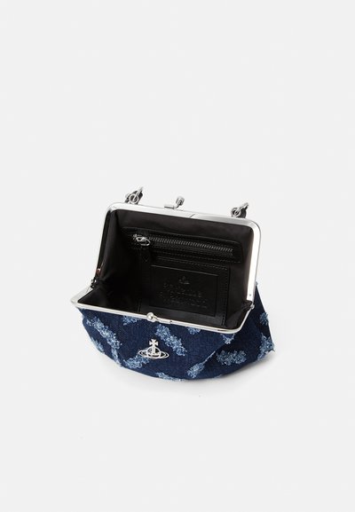 Navy blue fabric bag with floral pattern, silver metal frame and clasp, black interior with a zip pocket and brand logo. Opened view.