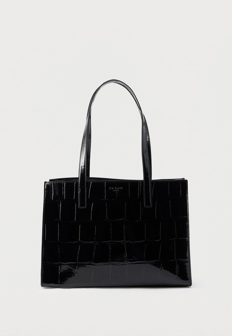 Black patent leather tote bag with woven texture, rectangular shape, dual handles, and a logo plate at the front.