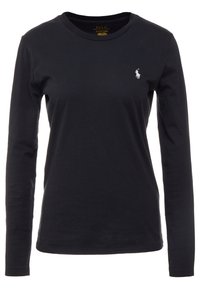 Musta pitkähiha t-paita, joka on valmistettu puuvillasta. Siinä on pyöreä kaula-aukko ja vasemmassa rinnassa pieni kirjailtu logo. Pehmeä pinta.