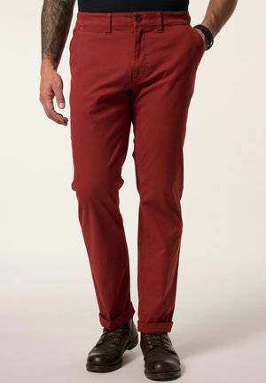 Rode katoenen broek met een slim fit, voorzien van een knopen- en ritsluiting, voorzakken en opgerolde broekspijpen. Stevige textuur.