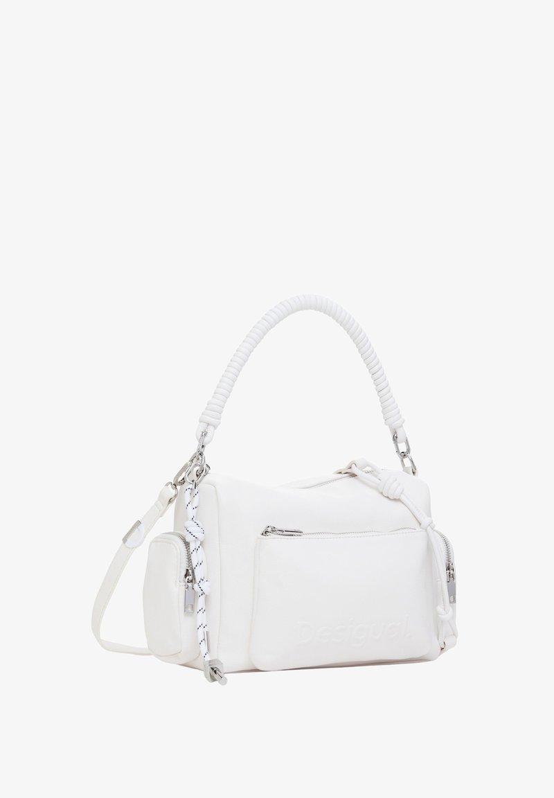 White leather handbag with a coiled handle, adjustable shoulder strap, silver hardware, and front zip pocket; embossed logo detail on the side.