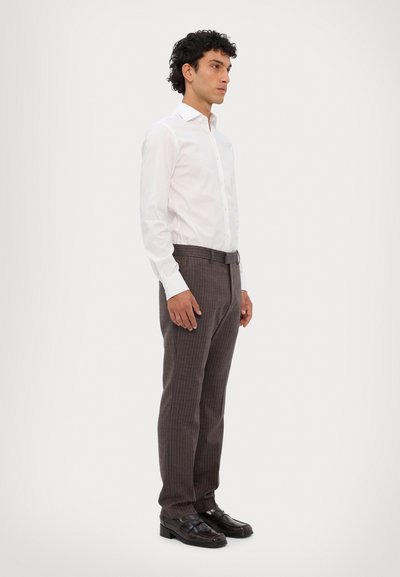 White long-sleeve shirt, brown pinstriped trousers, and black loafers. Slim fit, smooth texture, standard collar, and belt. Side view.