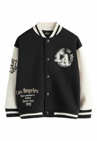 Black varsity jacket with cream sleeves, featuring embroidered text and patterns. Snap closure, ribbed cuffs and hem, and a relaxed fit.