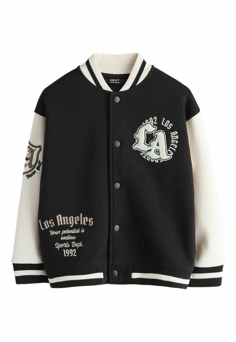 Black varsity jacket with cream sleeves, featuring embroidered text and patterns. Snap closure, ribbed cuffs and hem, and a relaxed fit.