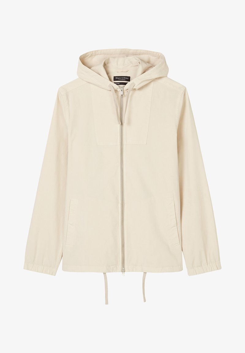 Veste beige à capuche avec fermeture éclair frontale, deux poches latérales, poignets élastiques et cordons de serrage ajustables à l'ourlet.