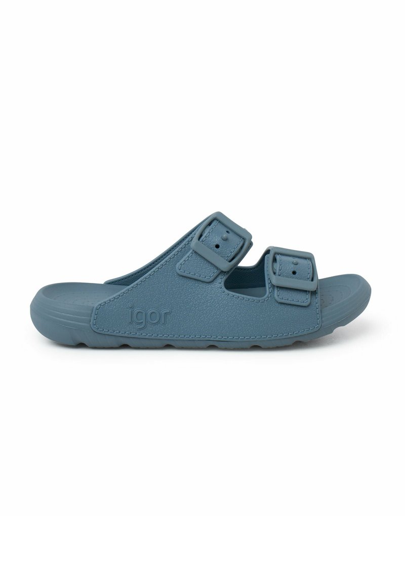 Blauwe rubberen slip-on sandaal met dubbele verstelbare gespen, textuur op de bovenkant en een gevormde voetbed voor comfort. Logo ingedrukt op de zijkant.
