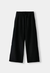 Pantalons larges noirs en tissu léger, dotés d'une taille élastique avec un cordon de serrage à nouer et sans motifs visibles.