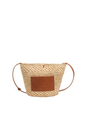 Woven straw handbag with a tan leather rectangular patch featuring embossed text. Detachable leather strap, conical shape with open top.