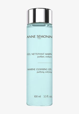Klare zylindrische Flasche Anne Semonin Marine Cleansing Gel, 100 ml, hellblaue Flüssigkeit mit silbernem Schraubverschluss.
