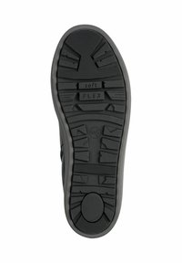 Black rubber shoe sole with a textured tread pattern. Notable features include “soft” and “FLEX” markings, providing grip and flexibility.