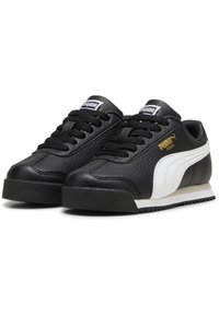 Mustad nahast tennisekad, millel on tektekstuur, valge külgtriip, mustad paelad ja kummist tald. Küljel kuldne "Puma" logo.