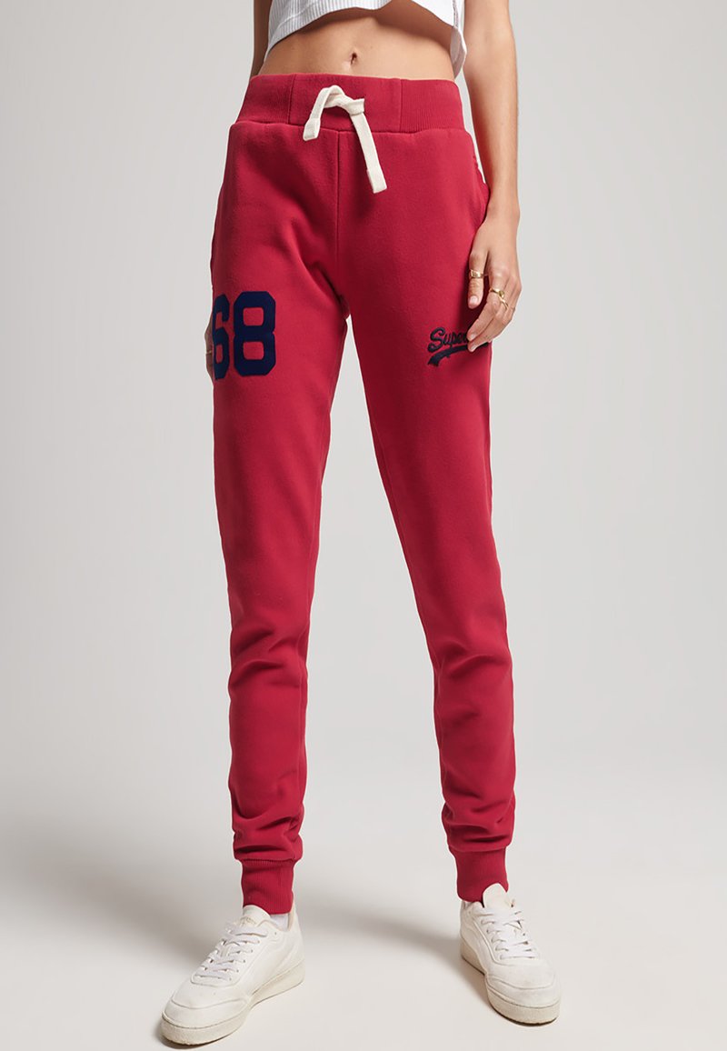 Superdry Tracksuit bottoms varsity red/red Zalando.co.uk