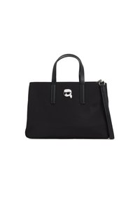 Borsa tote nera in nylon con due manici superiori, chiusura a zip e un accento argentato che presenta il volto di un personaggio con occhiali da sole. Texture liscia.