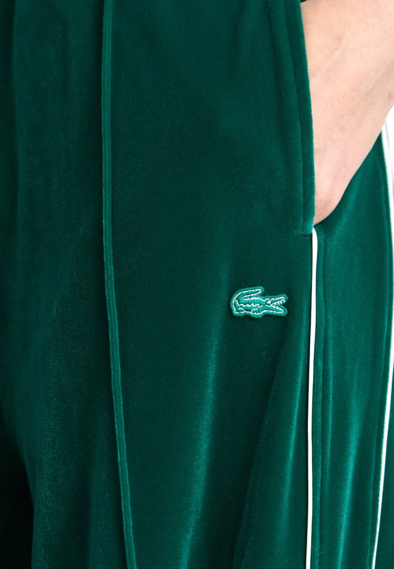 Lacoste Tracksuit bottoms - fluorine foncé/white/green - Zalando.co.uk