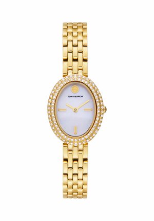 Guldtonet Tory Burch armbåndsur med oval skive af perlemor, krystaller rundt om ringen, minimalistiske gyldne markører og ledet armbånd.