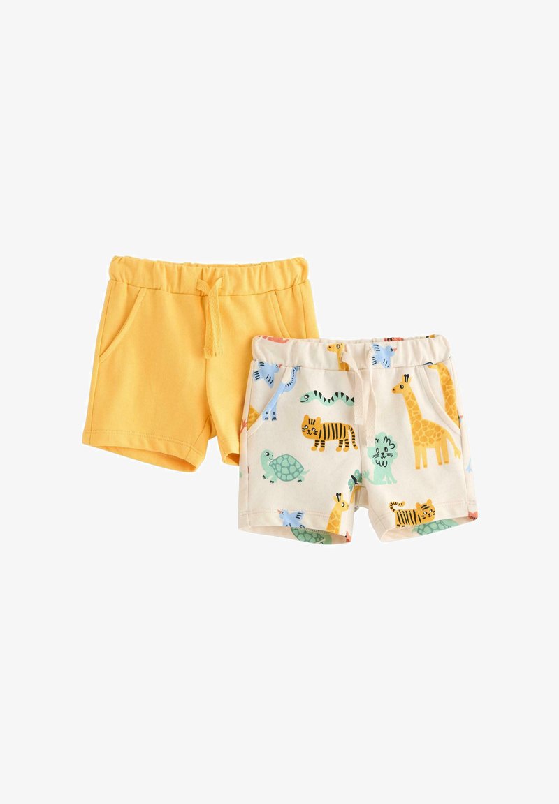 To sæt børneshorts: et par i ensfarvet gul med elastisk linning og et par i cremefarvet med farverige dyretryk, også med elastisk linning.