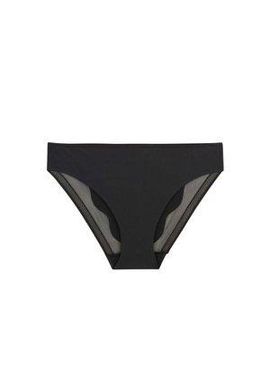 Biancheria intima stile bikini nera con pannelli trasparenti in mesh e cuciture a zigzag lungo le aperture delle gambe su sfondo bianco.