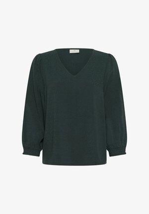 Blusa verde scuro con scollo a V, maniche lunghe a palloncino e polsini elasticizzati. Il materiale presenta un delicato motivo testurizzato.