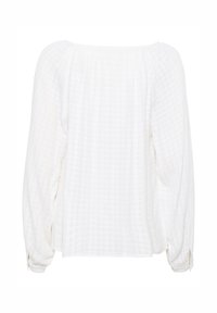 White long-sleeve blouse featuring a textured grid pattern, round neckline, and gathered fabric at the shoulders. Button detail at cuffs.