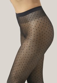 Collant neri trasparenti con motivo a pois, texture liscia e vita elastica nera solida. I pois sono distribuiti uniformemente e variano di dimensione.