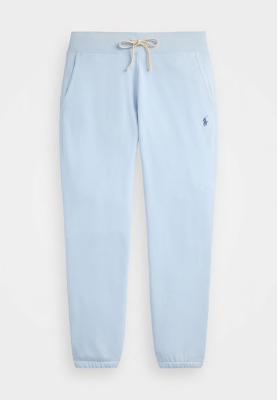 Pantalon de survêtement bleu clair en tissu doux, avec une taille élastique munie d'un cordon de serrage, des poches latérales et des poignets côtelés.