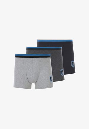 Three pairs of men's boxer shorts in gray, dark gray, and navy, featuring elastic waistbands with blue and black stripes and logo accents.