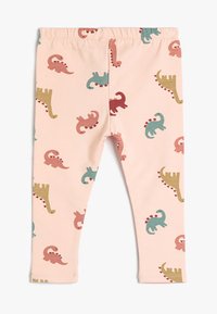 Leggings de color rosa claro con un estampado de dinosaurios en verde, rojo y azul. Tejido suave y elástico con cintura de goma y diseño ajustado.