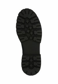 Suela de zapato de goma negra con tacones profundos y patrones cruzados para agarre, con un borde liso y una sección media texturizada. Talla indicada como 37.
